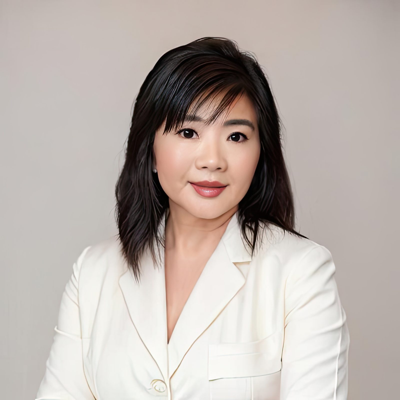 Ginger King, cosmetic chemist and founder of Grace Kingdom Beauty, known as The Beauty Shark, in a cream blazer