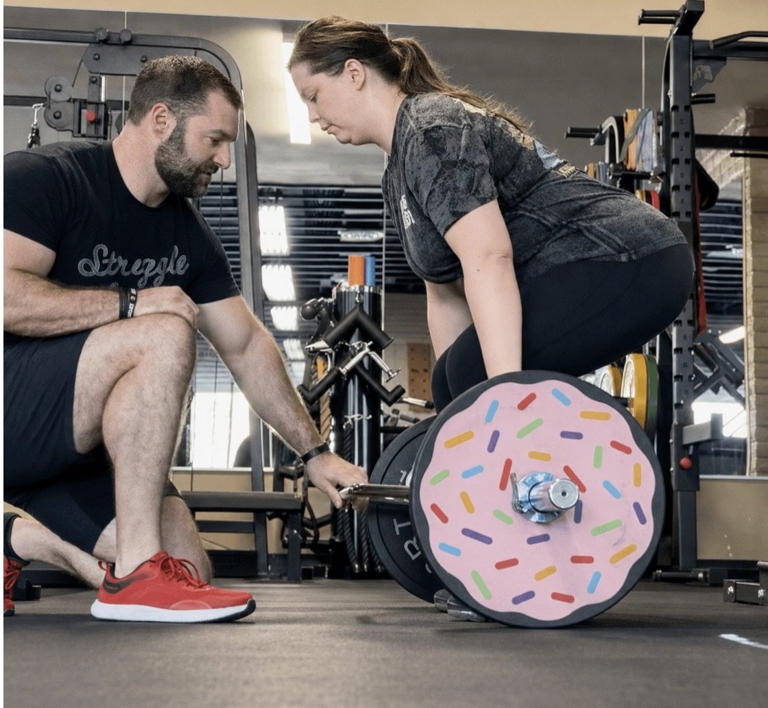 Matt Hitzhusen coaching a client through a deadlift at HITZ Fitness in Phoenix