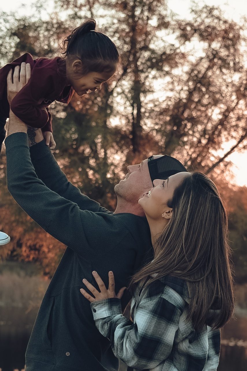 Renee Ambrose with her family outdoors in autumn
