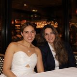 Maria Adelaida Suarez, co-founder of Bringing Happiness Foundation, with her sister and co-founder Lina Suarez at a restaurant table