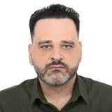 Ray Almir, CEO of Eagle Tec, in a dark green shirt against a white background